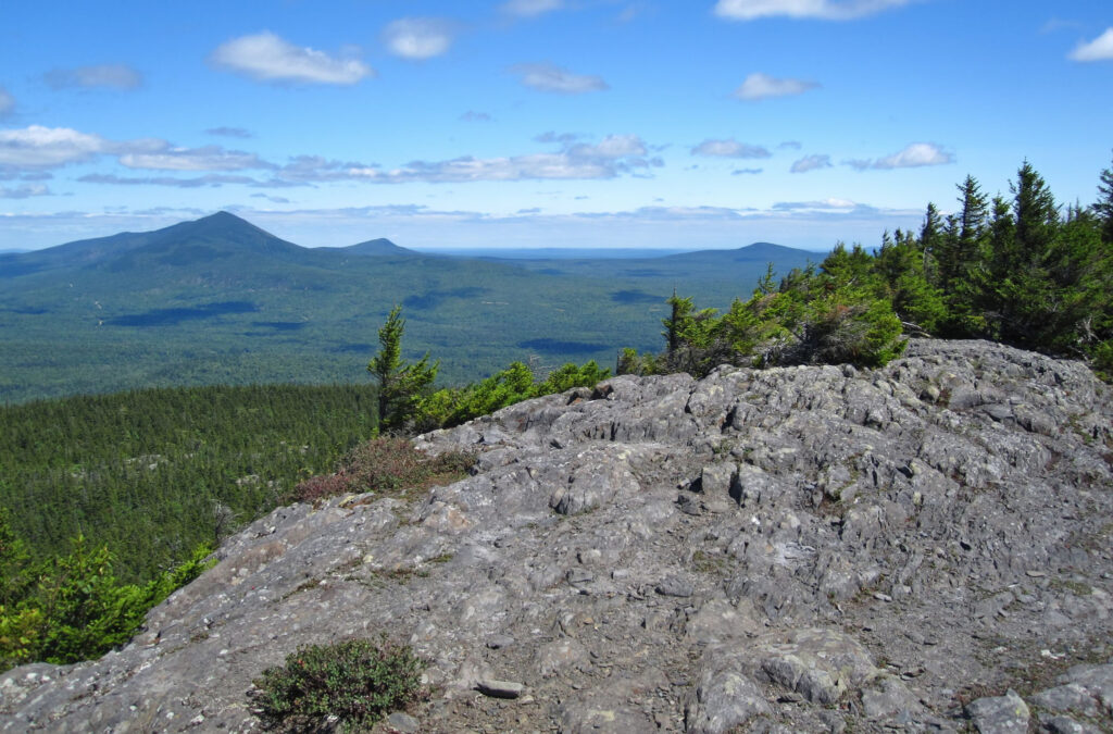 The rugged terrain of the Hundred Mile Wilderness in Maine, a challenging section of the Appalachian Trail for off-grid adventures.