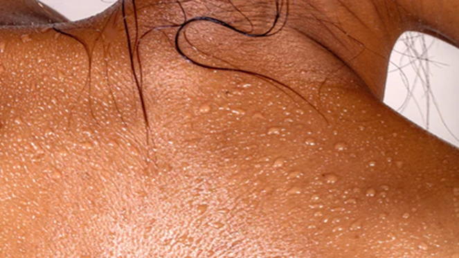 Woman gently using hypoallergenic body wash on her skin.